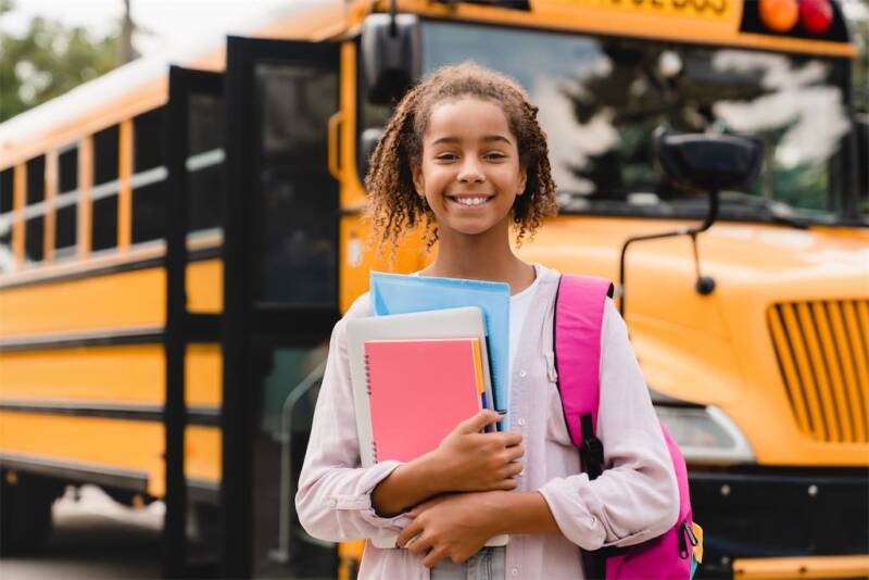  smiling-african-american-schoolgirl-going-back-to-school